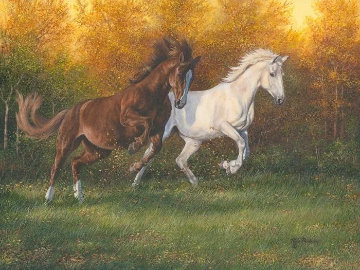 Two horses running playfully through an autumn field with golden trees behind, original equine painting by Kim Penner.
