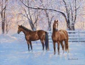 Horses standing in a snowy paddock with frost-covered ground and soft winter trees.